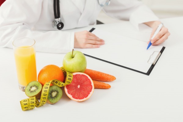 gallery/nutritionist-desk-with-fruit-and-measuring-tape-phwmu4s